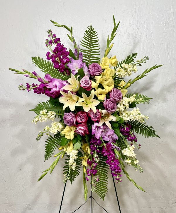 Ray of Light Standing spray of yellow lilies, yellow stock, lavender roses, lavender gladiolus, and purple stock designed by la paloma blanca floral designs in scottsdale az